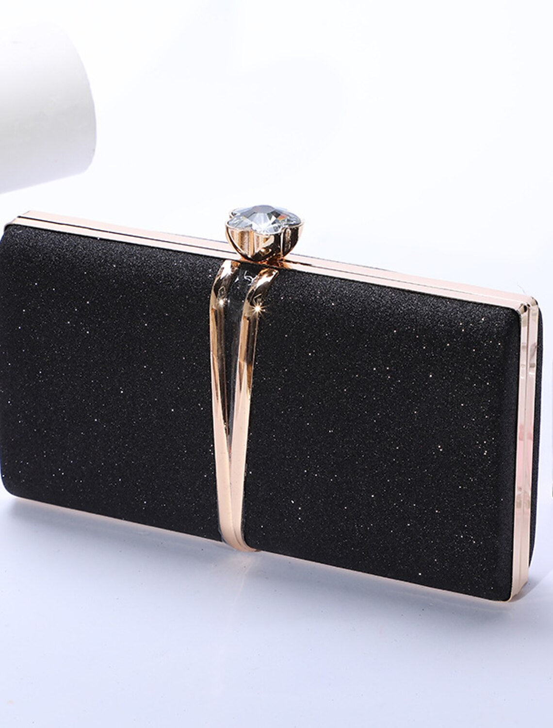 Elegant rhinestone wristlet clutch bag, front view.