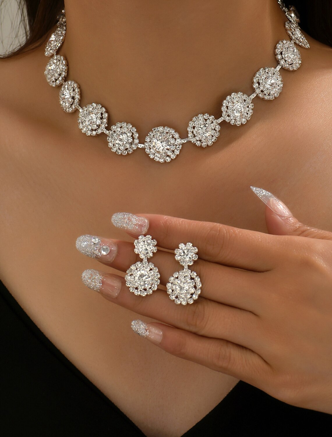 Rhinestone geometric necklace and matching earrings set.