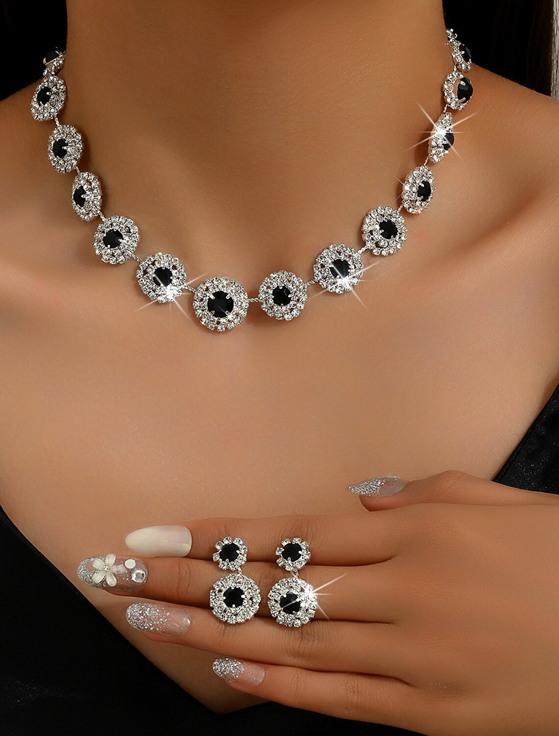 Close-up of rhinestone geometric necklace.