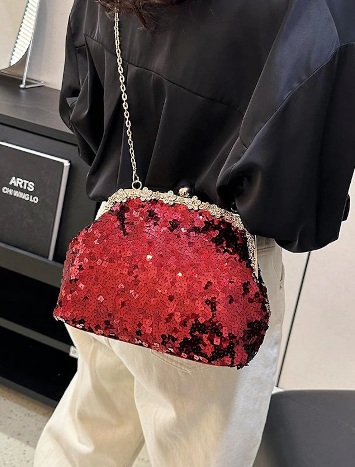PU leather evening purse with sequin detail.