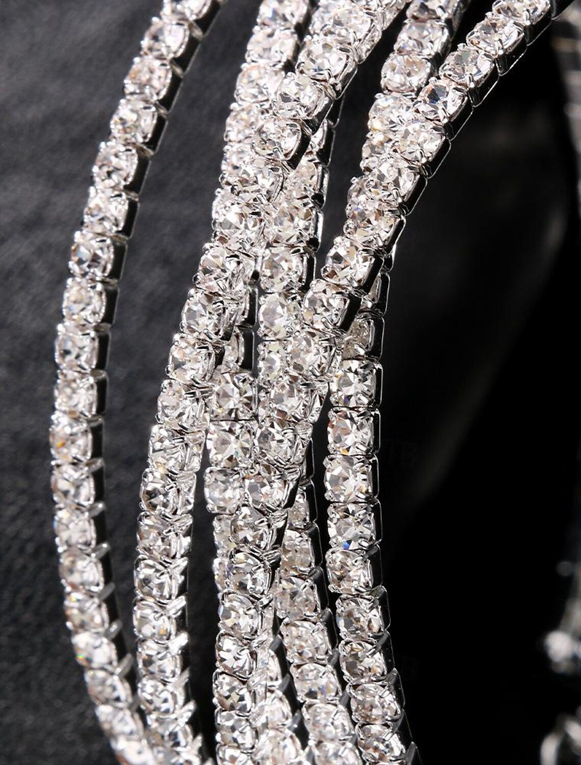 A woman wearing the silver rhinestone tennis bracelet, highlighting its refined look.