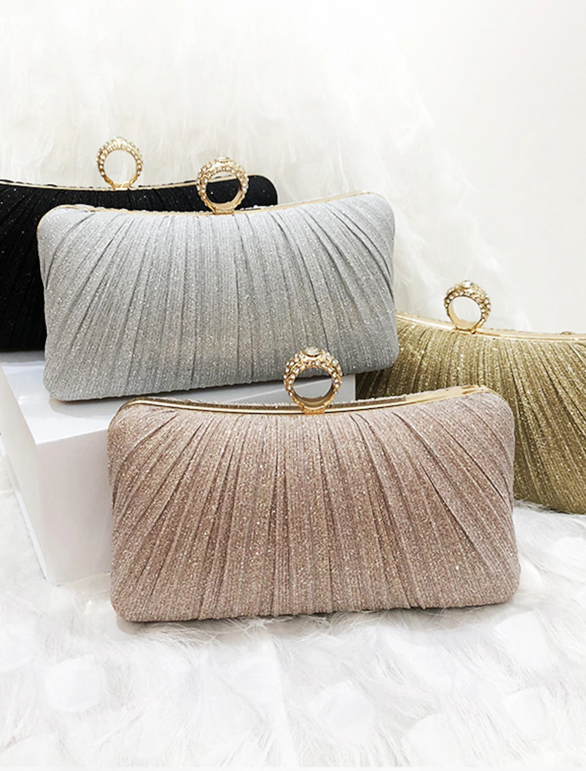 Elegant women's synthetic clutch evening bag with a chain strap.