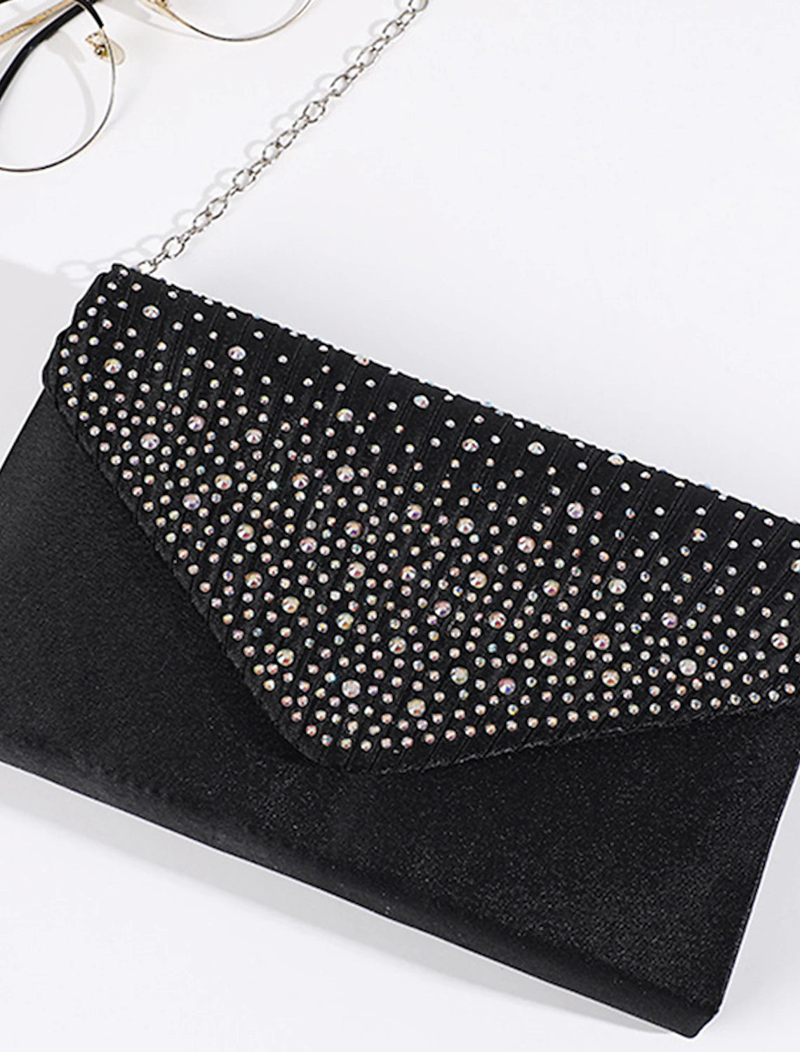 Sparkling tri-fold clutch bag for evening and formal events.