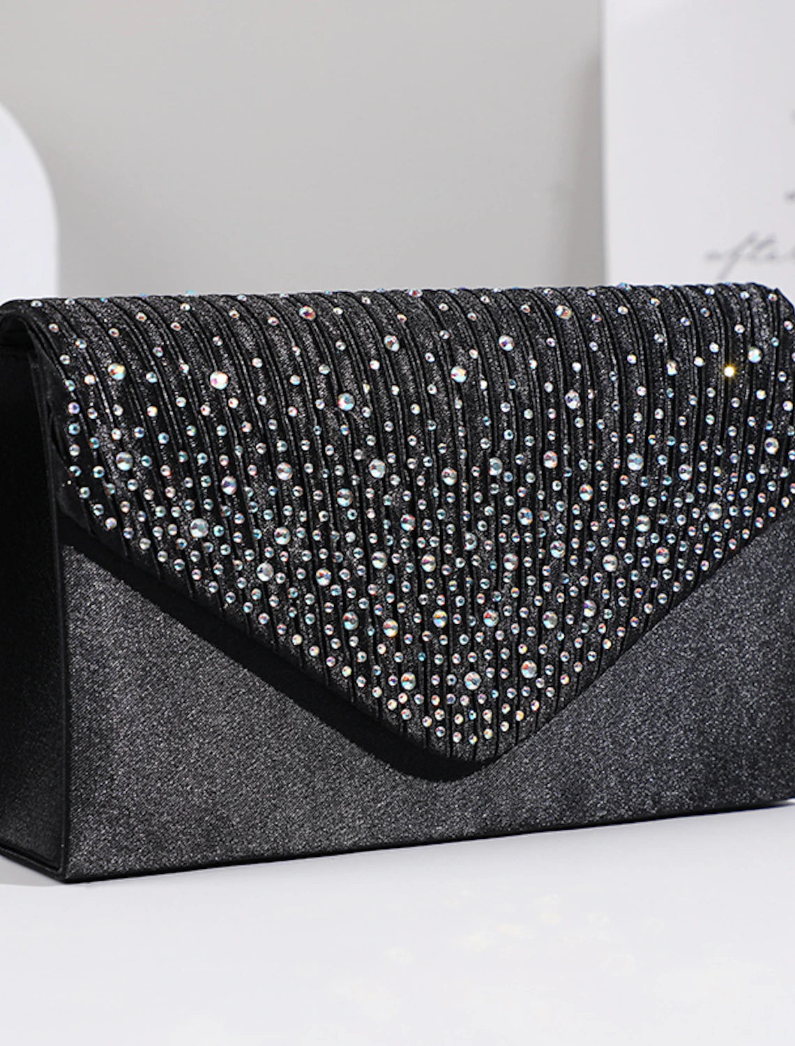 Elegant women's clutch bag featuring crystal and rhinestone embellishments.