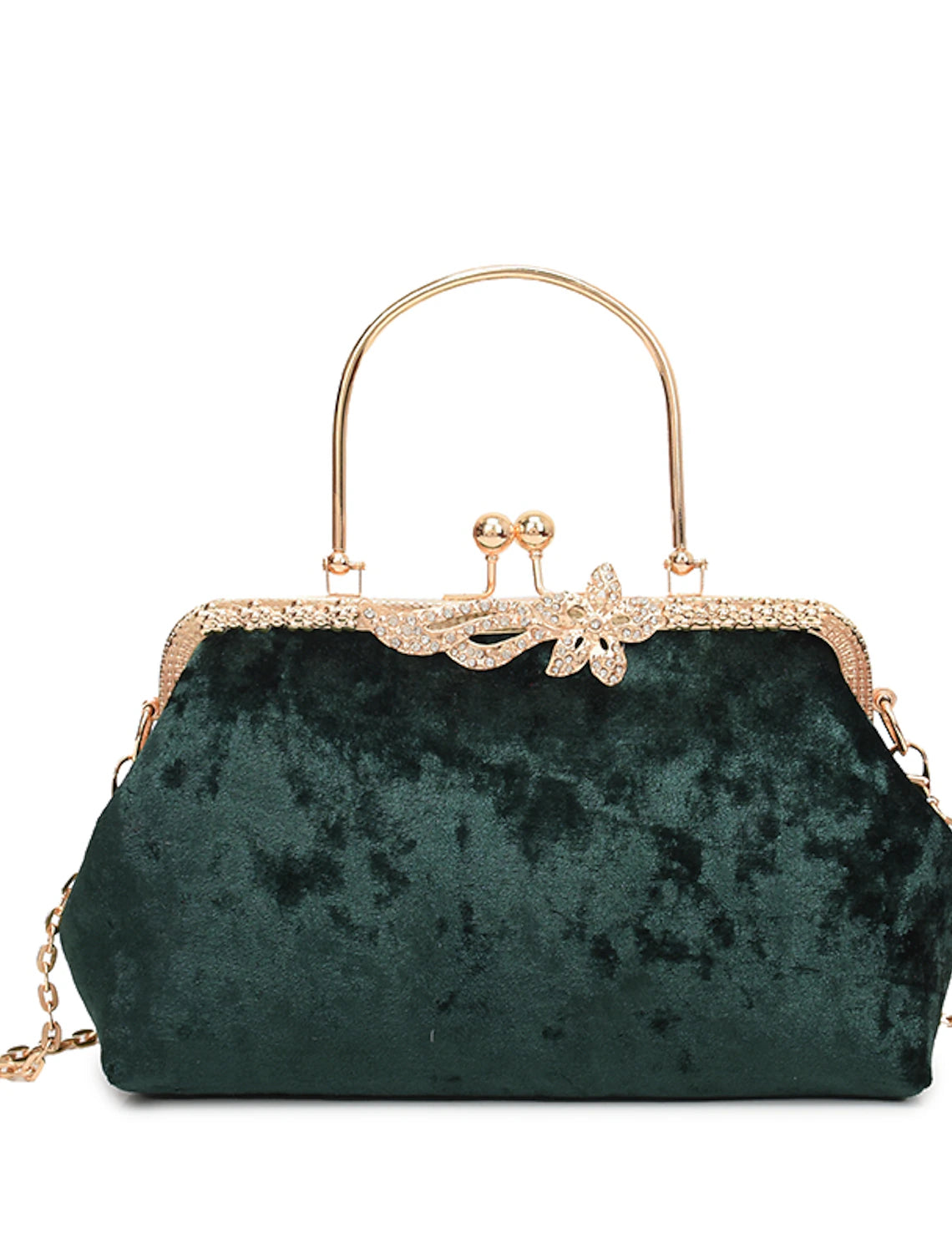 Dark velvet evening bag held by hand, showcasing its size.