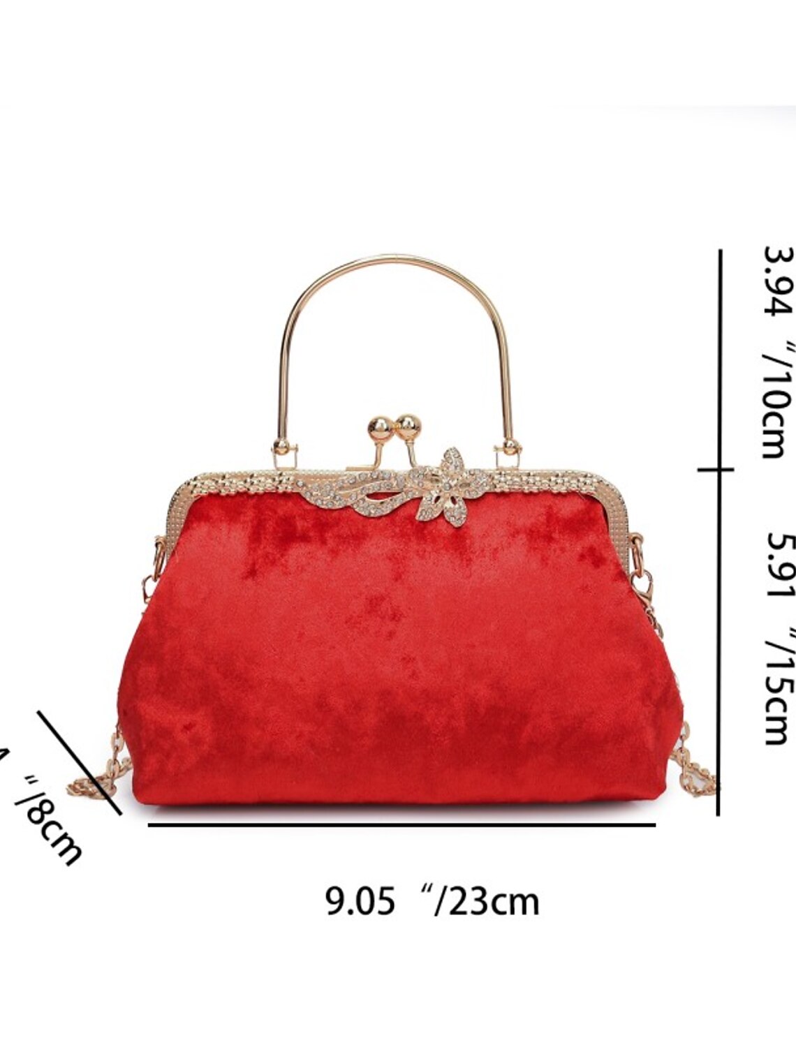 Dark velvet evening bag with chain strap, styled for an event.