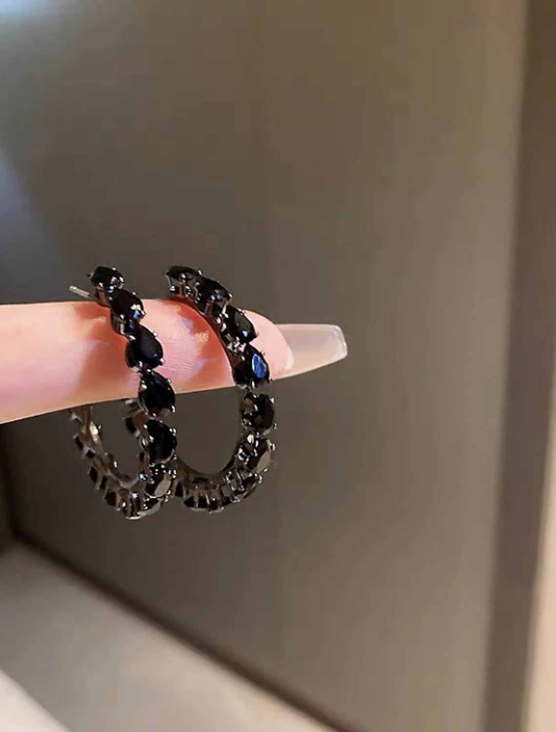Pair of women's zircon hoop earrings, presented in a classic silver finish.