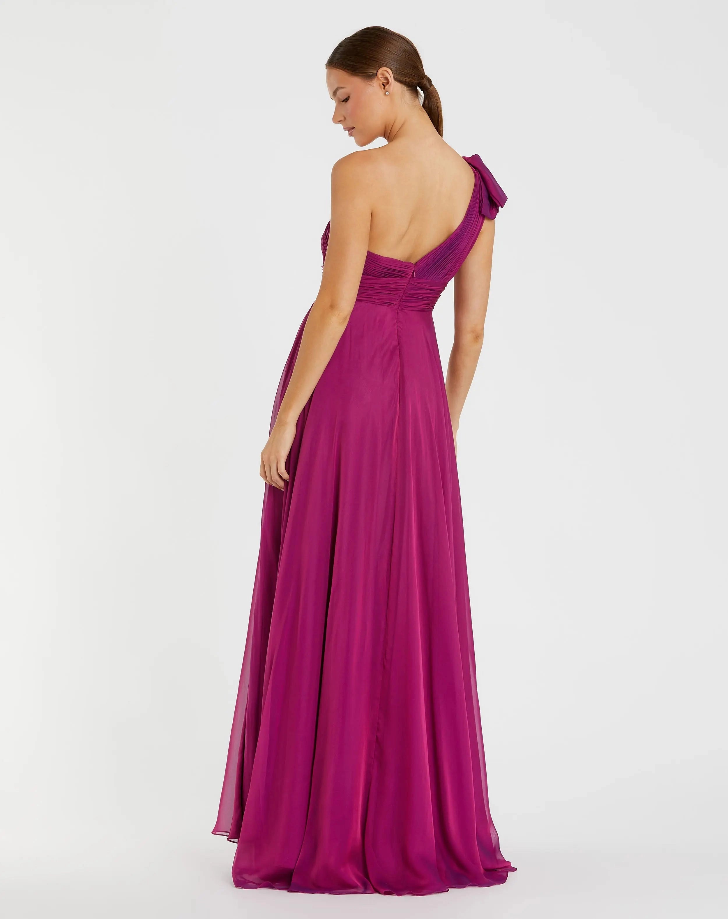 One shoulder magenta chiffon bow slit prom gown