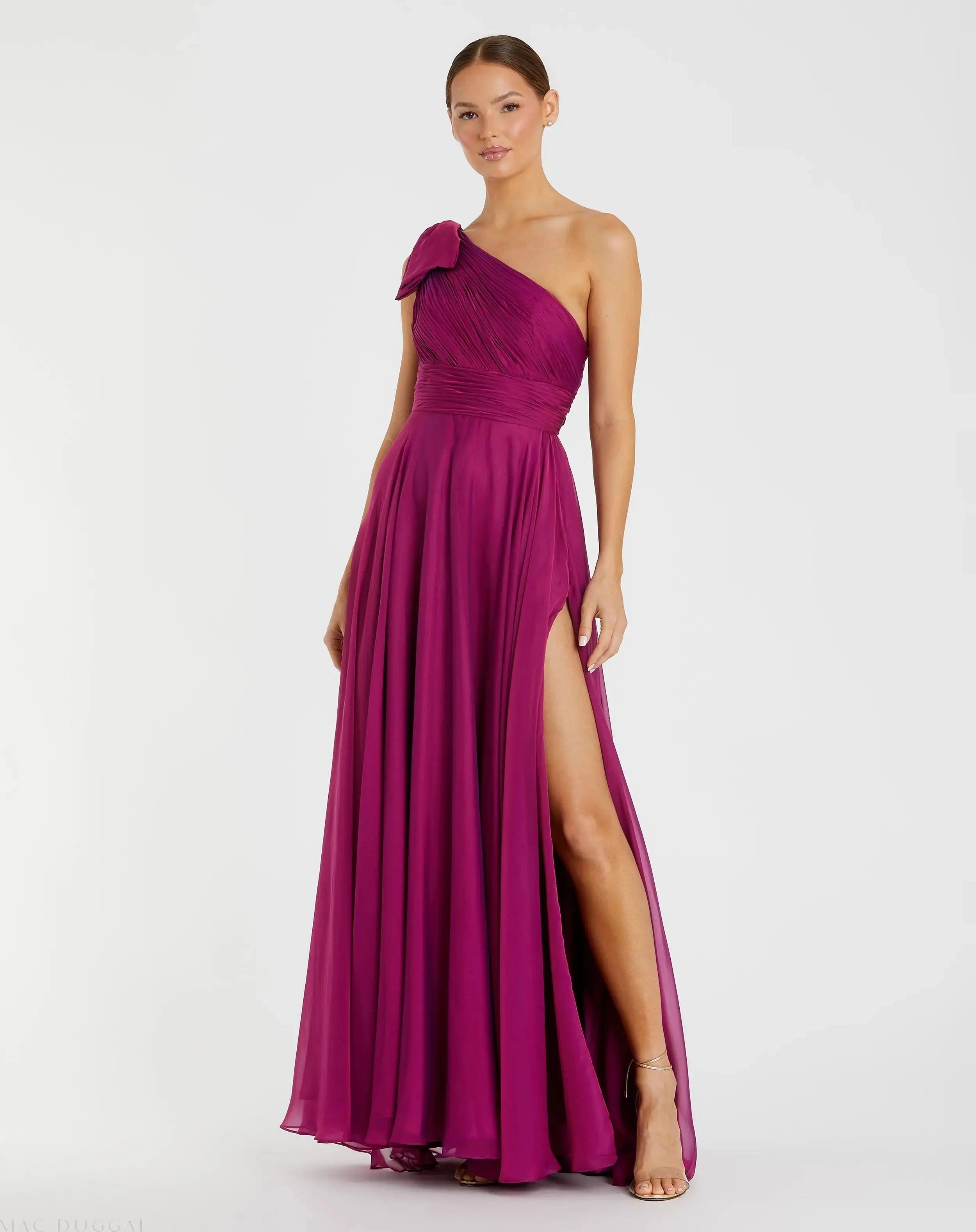 One shoulder magenta chiffon bow slit prom gown