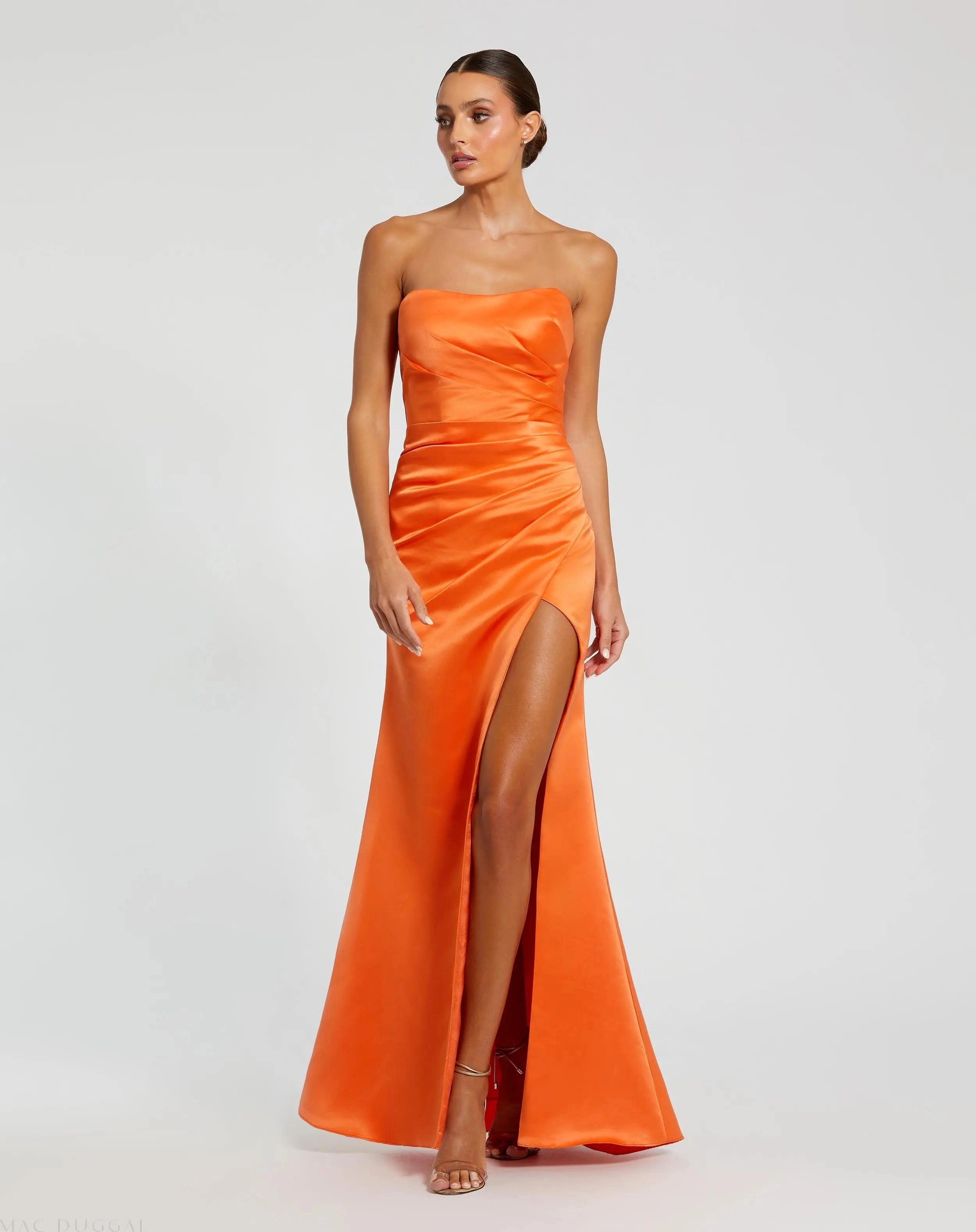 Orange strapless satin ruched high slit prom gown