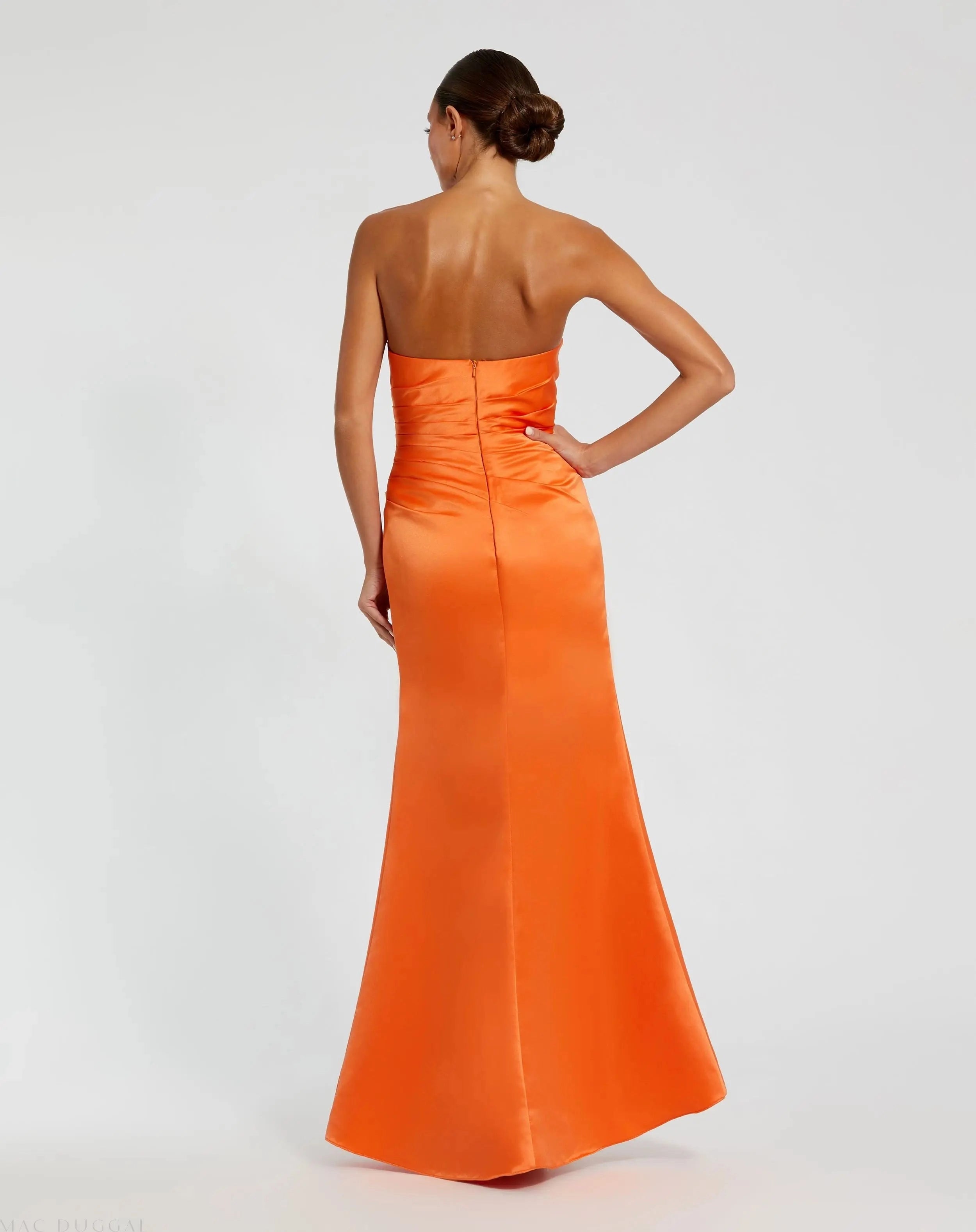 Orange strapless satin ruched high slit prom gown