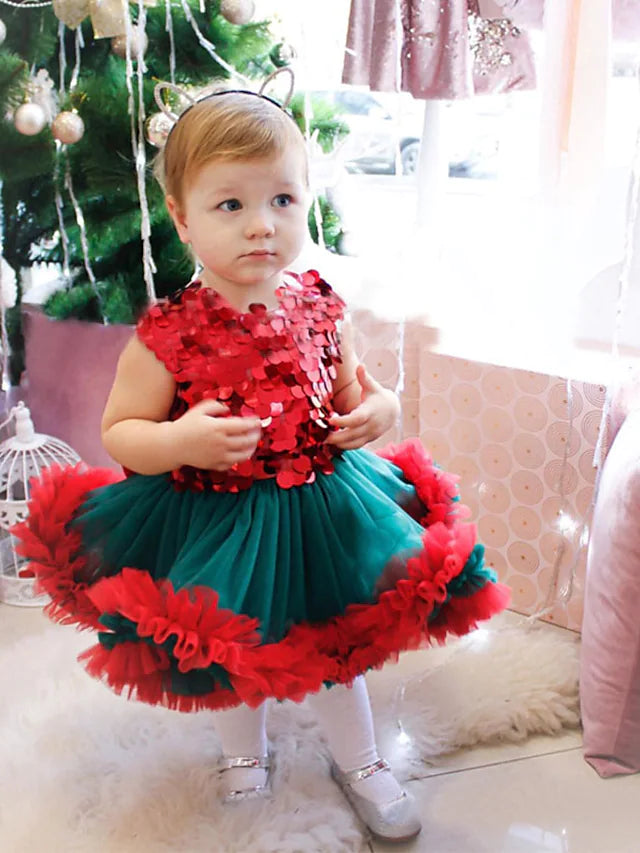 Back view of the knee-length tulle flower girl dress, highlighting the bow details.