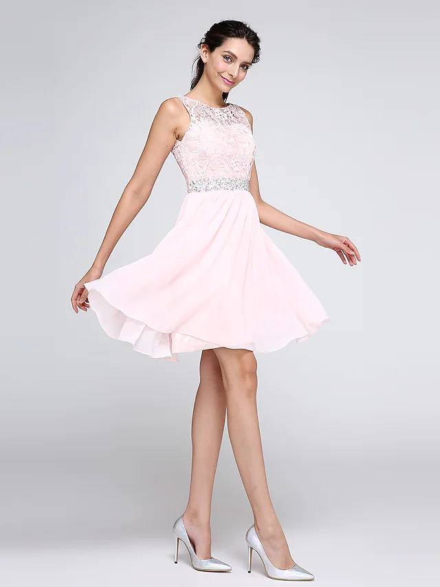 A-Line short mini cocktail dress featuring an illusion neck, sleeveless design, and crystal-embellished lace.