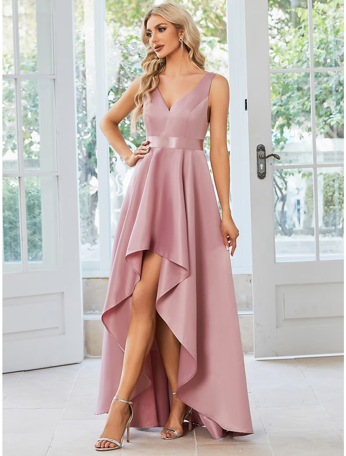 Close-up of the satin fabric and asymmetrical ruffles on the dress.