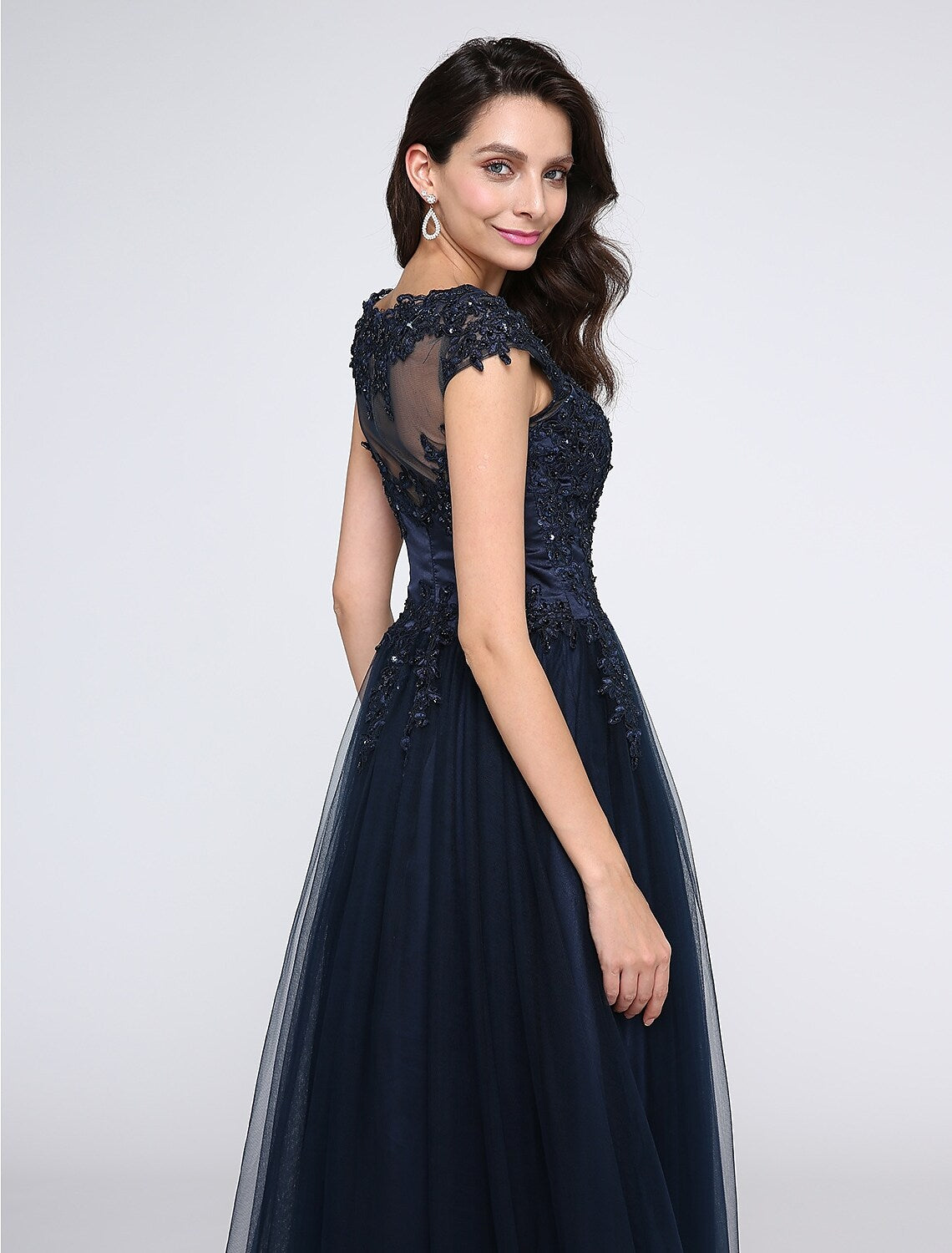 Side view of an elegant black floor-length A-line dress with V-neck.