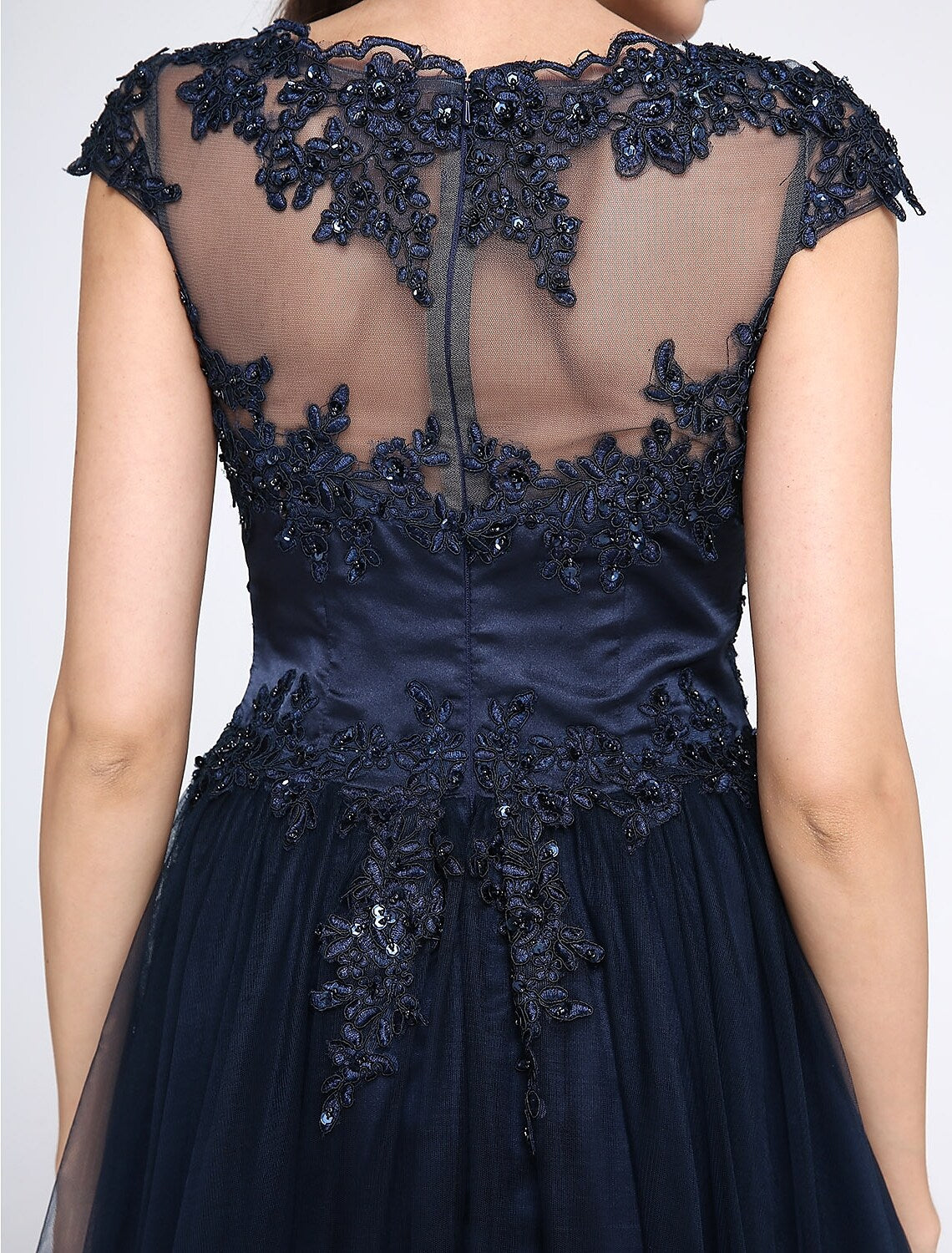 Full length view of the black A-line wedding guest dress.