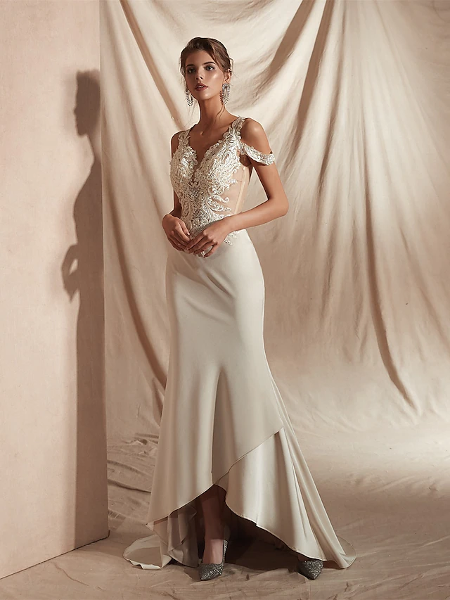 Side view of V-neck mermaid wedding gown.