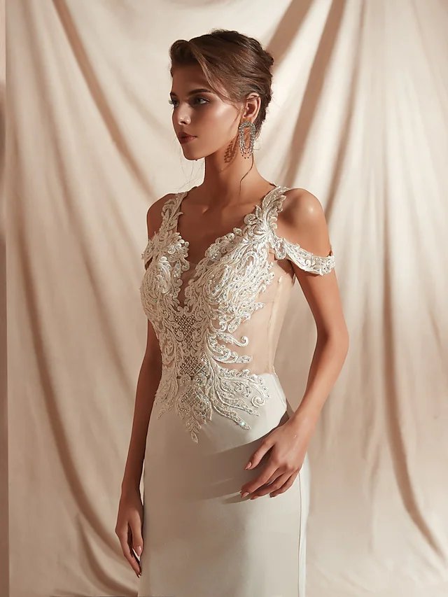 Full length view of bride wearing matte satin wedding dress.