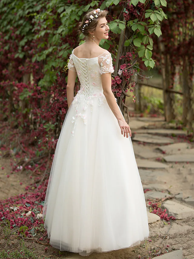 Back view of the A-Line wedding dress showing floral appliques.