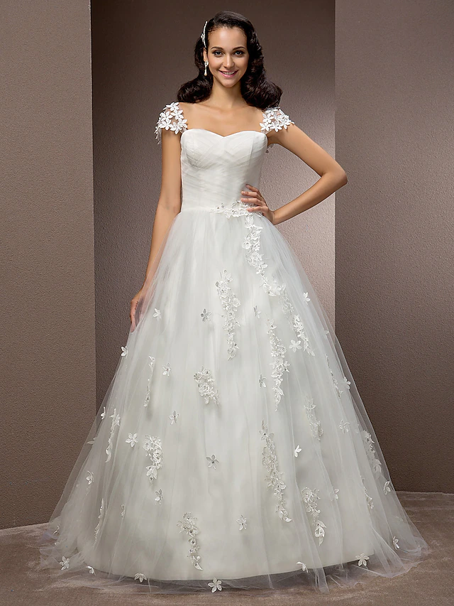 Elegant ball gown wedding dress with square neckline and short sleeves.