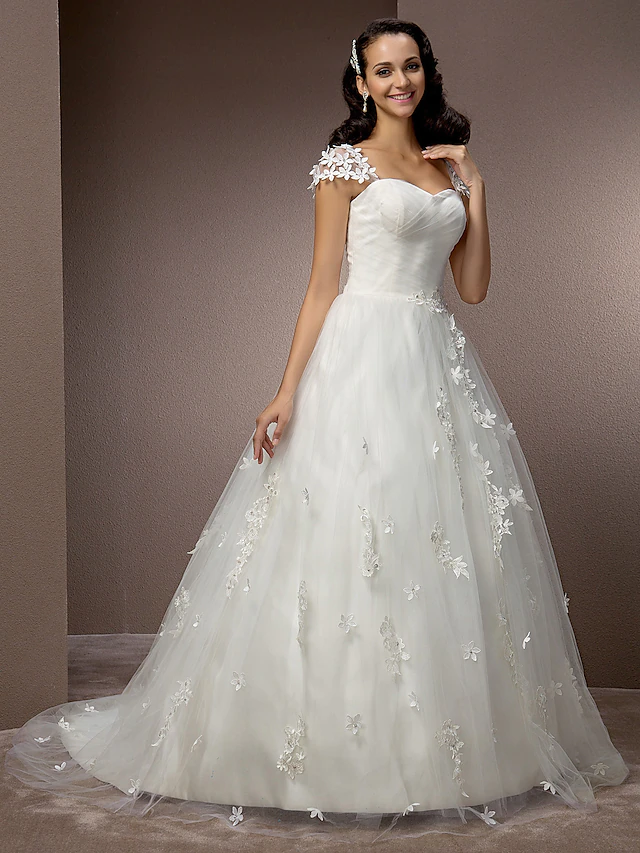 Back view of a wedding ball gown with court train and ruched tulle.