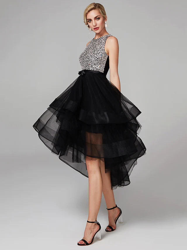 Side view of the high-low ball gown showcasing cascading ruffles and beading.