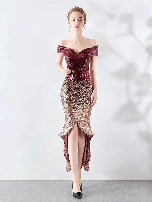 Woman wearing a dazzling sequined off-shoulder mermaid cocktail dress with an asymmetrical hem.