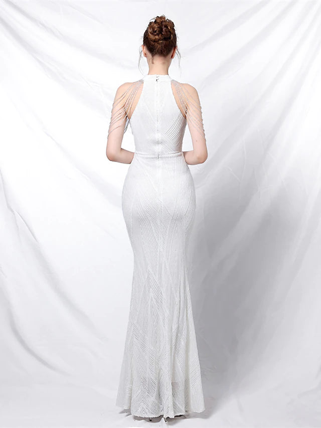 Back view of a sequined halter neck mermaid gown.