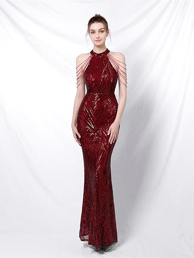 Full length view of a sequined trumpet prom dress.