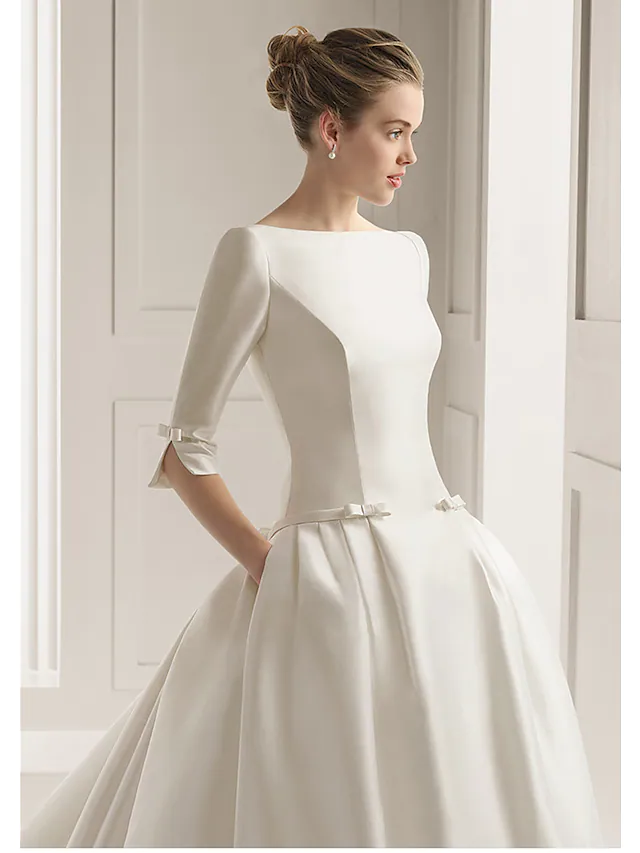 Side profile of a beautiful A-line wedding gown.