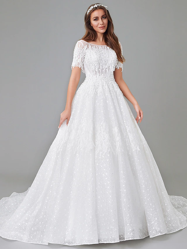 Elegant A-line wedding dress with bateau neck and short sleeves.