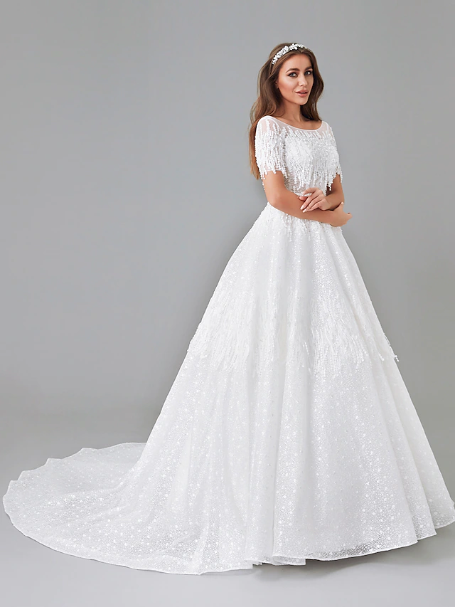 Side view of the A-line wedding gown with flowing skirt.