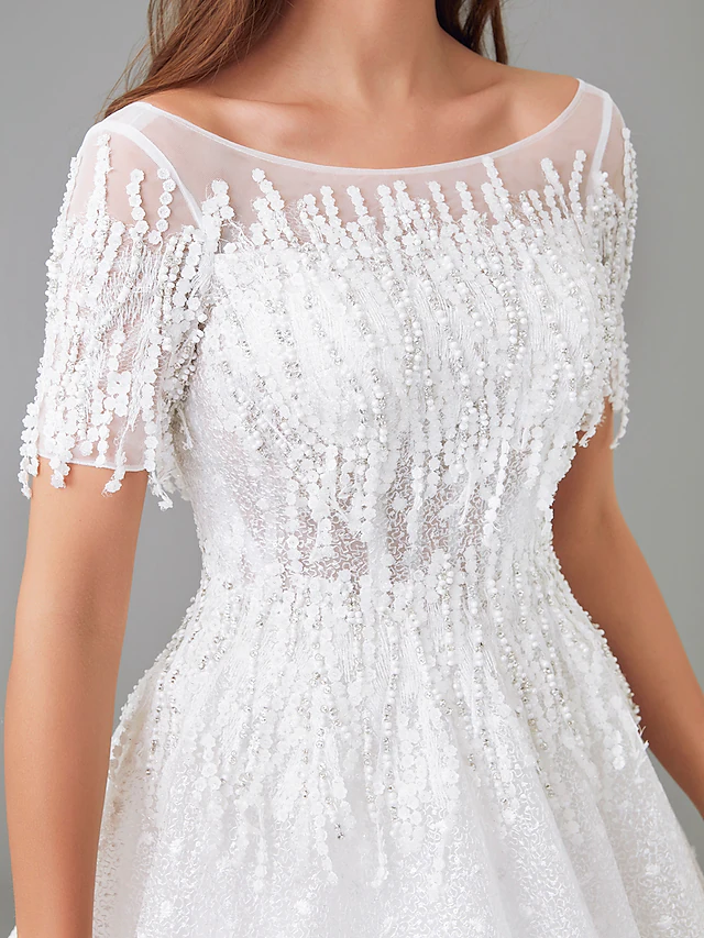 Detail of the short sleeve with see-through lace insert.