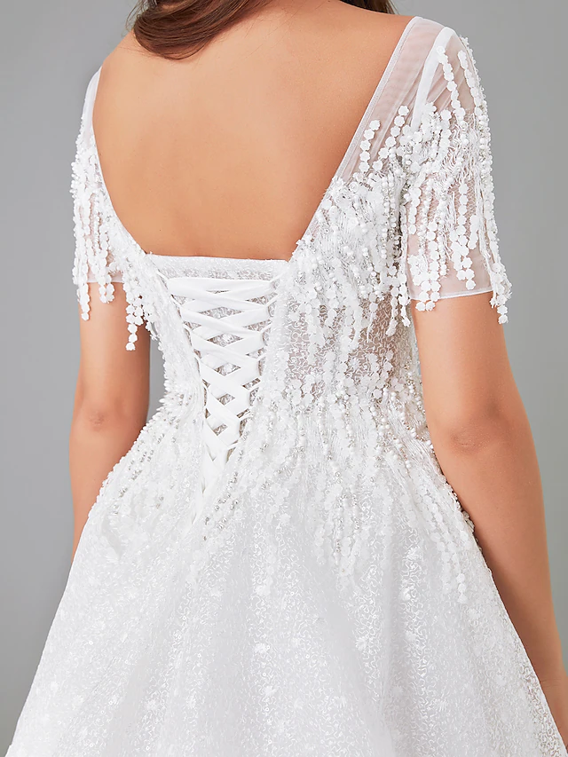 Full length view of a bride wearing the A-line wedding dress.