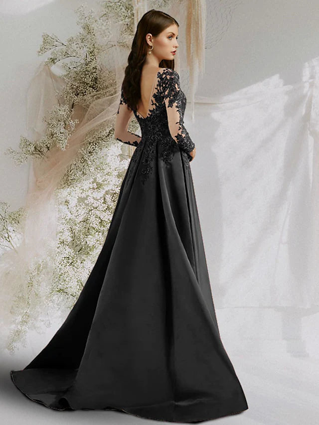 Back view of an A-line satin evening dress featuring floral appliques and a sweep train.