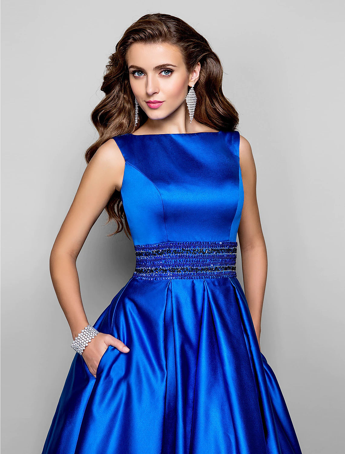 Side view of the A-line dress, highlighting the flowing pleats.