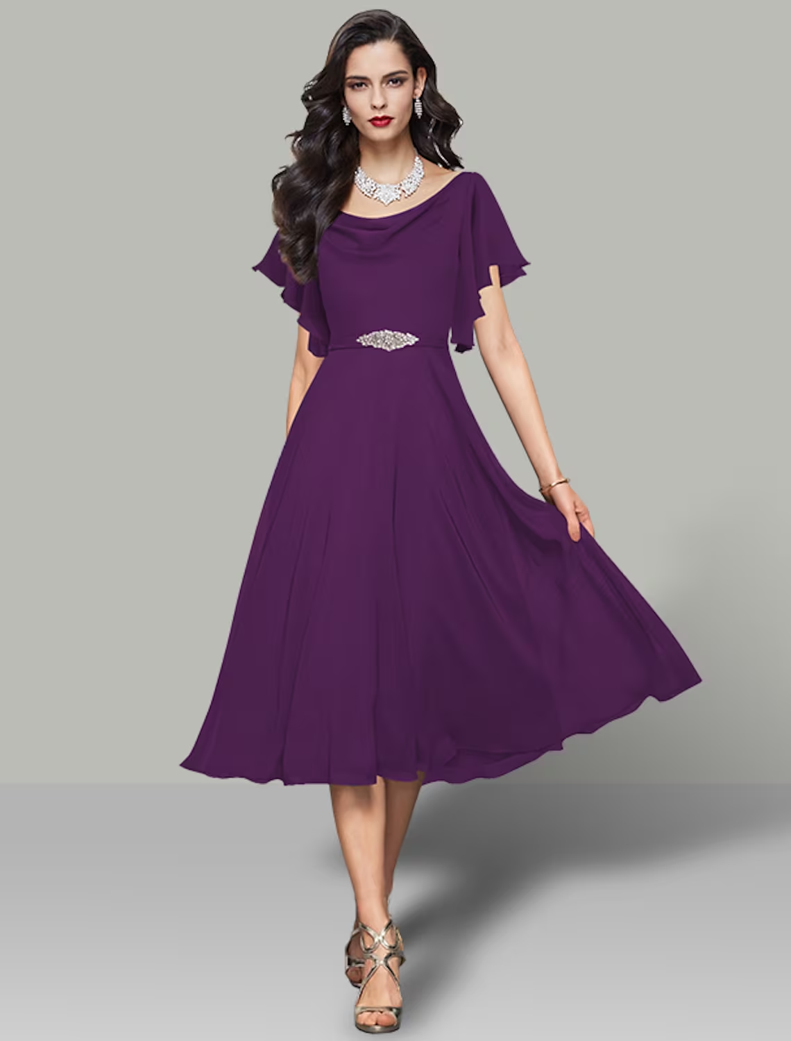 Detail of the rhinestone embellishment and belt on the chiffon cocktail dress.