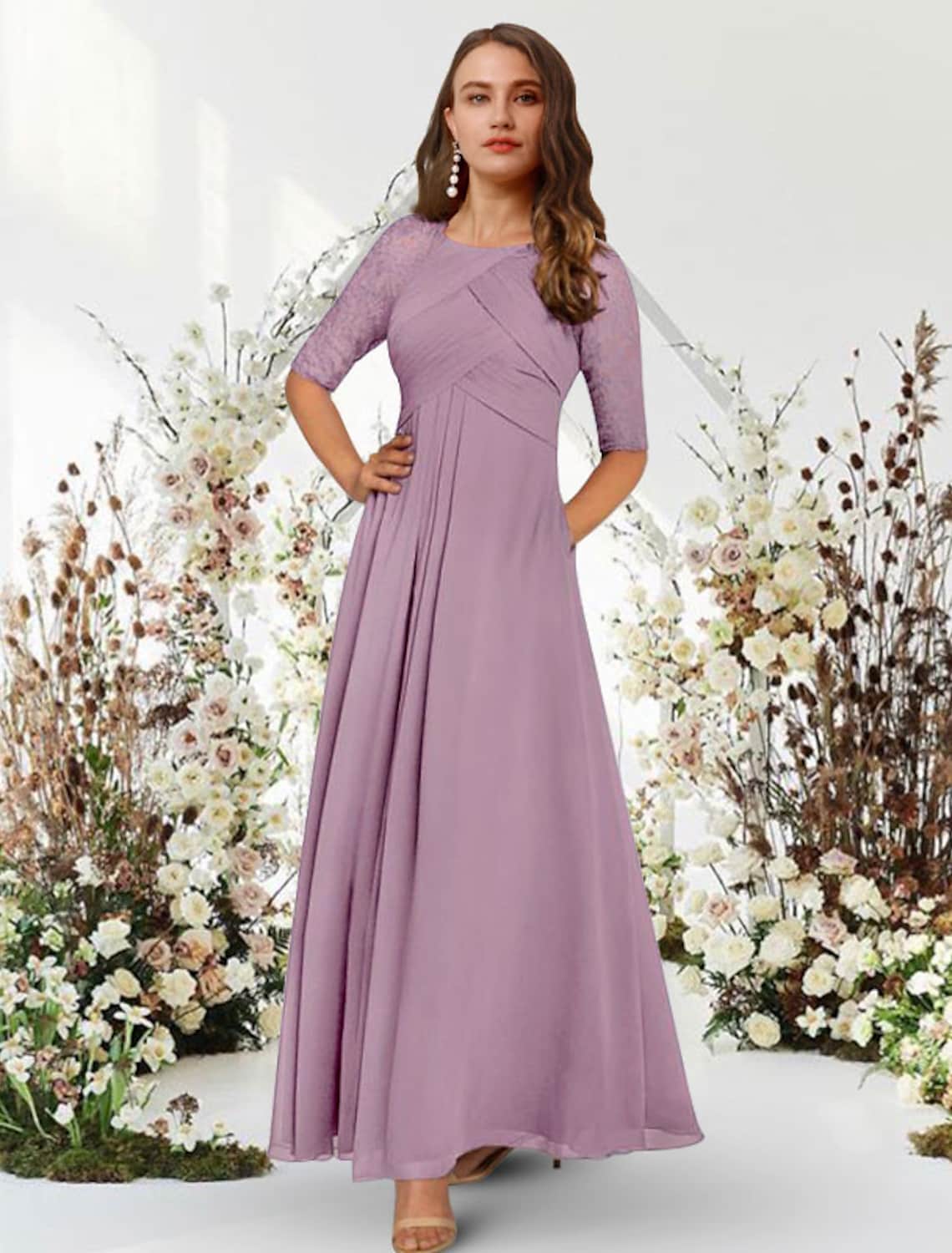 Elegant A-line chiffon evening gown with jewel neck and half sleeves.
