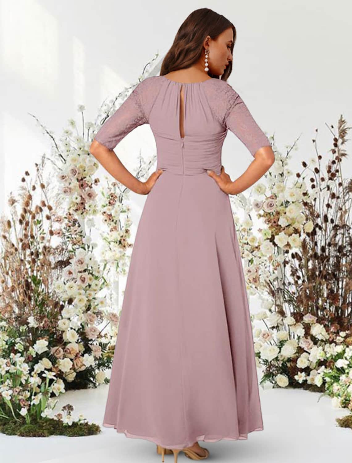Close-up of the jewel neck and half sleeves on the chiffon evening dress.