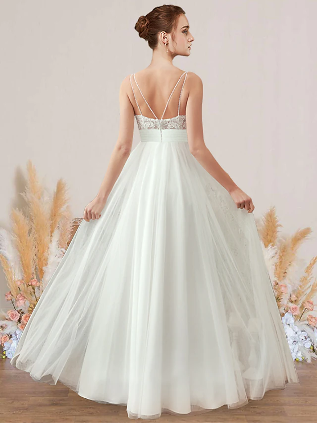 Back view of an elegant A-Line chiffon lace wedding dress with V-neck and spaghetti straps.