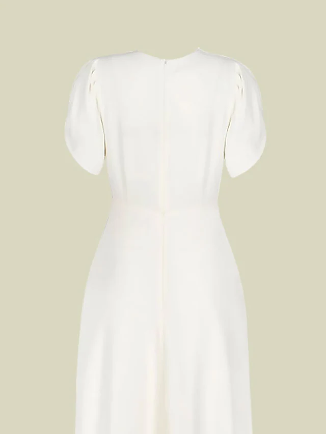 Side profile of the elegant V-neck Mother of the Bride dress.