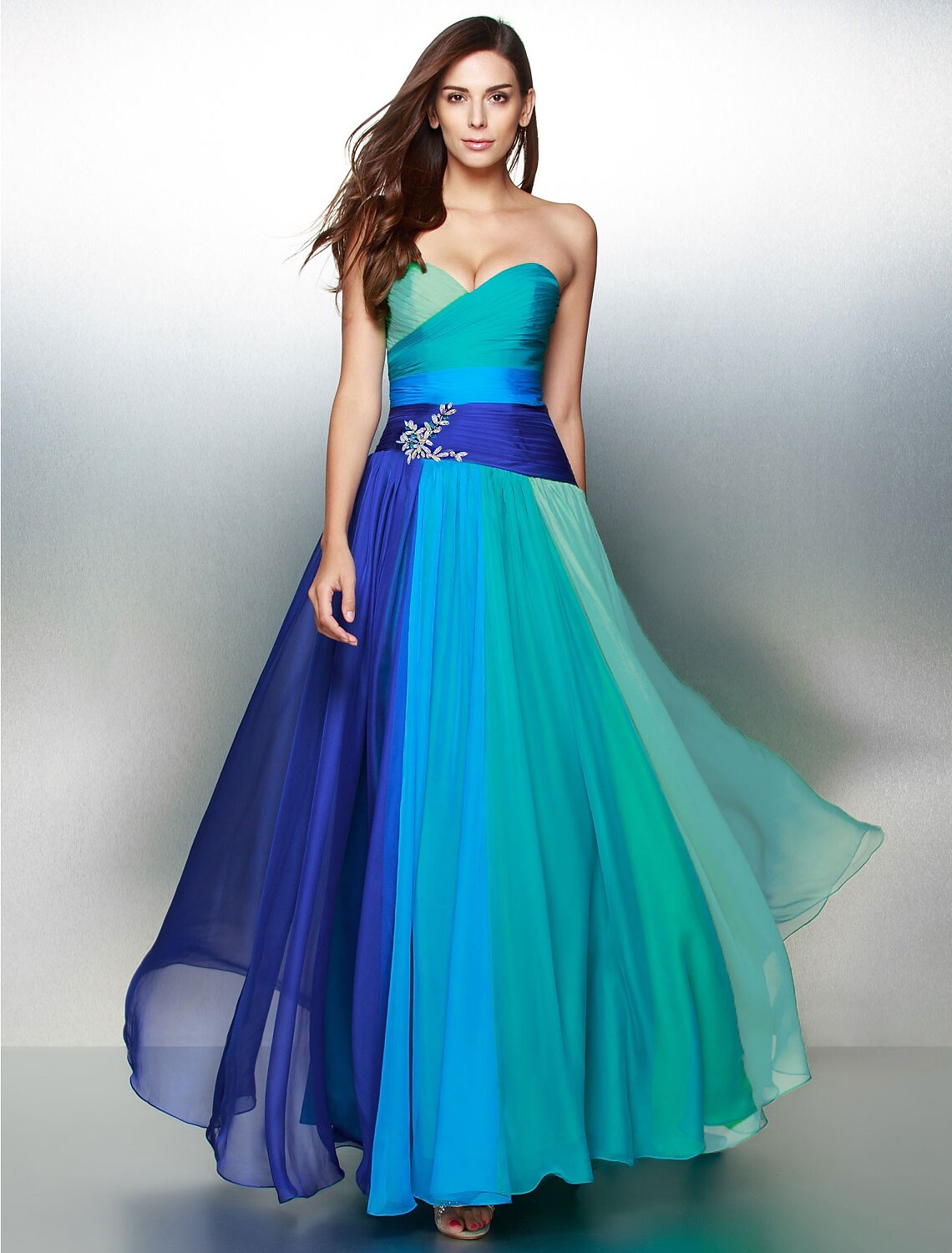 Back view of the floor length color block dress showing backless detail.