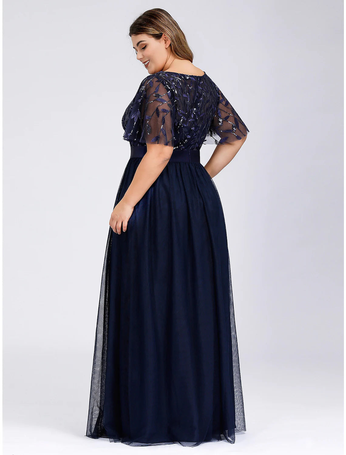 Side view of A-Line Empire Jewel Neck Short Sleeve Tulle Prom Gown with Sequin Appliques.