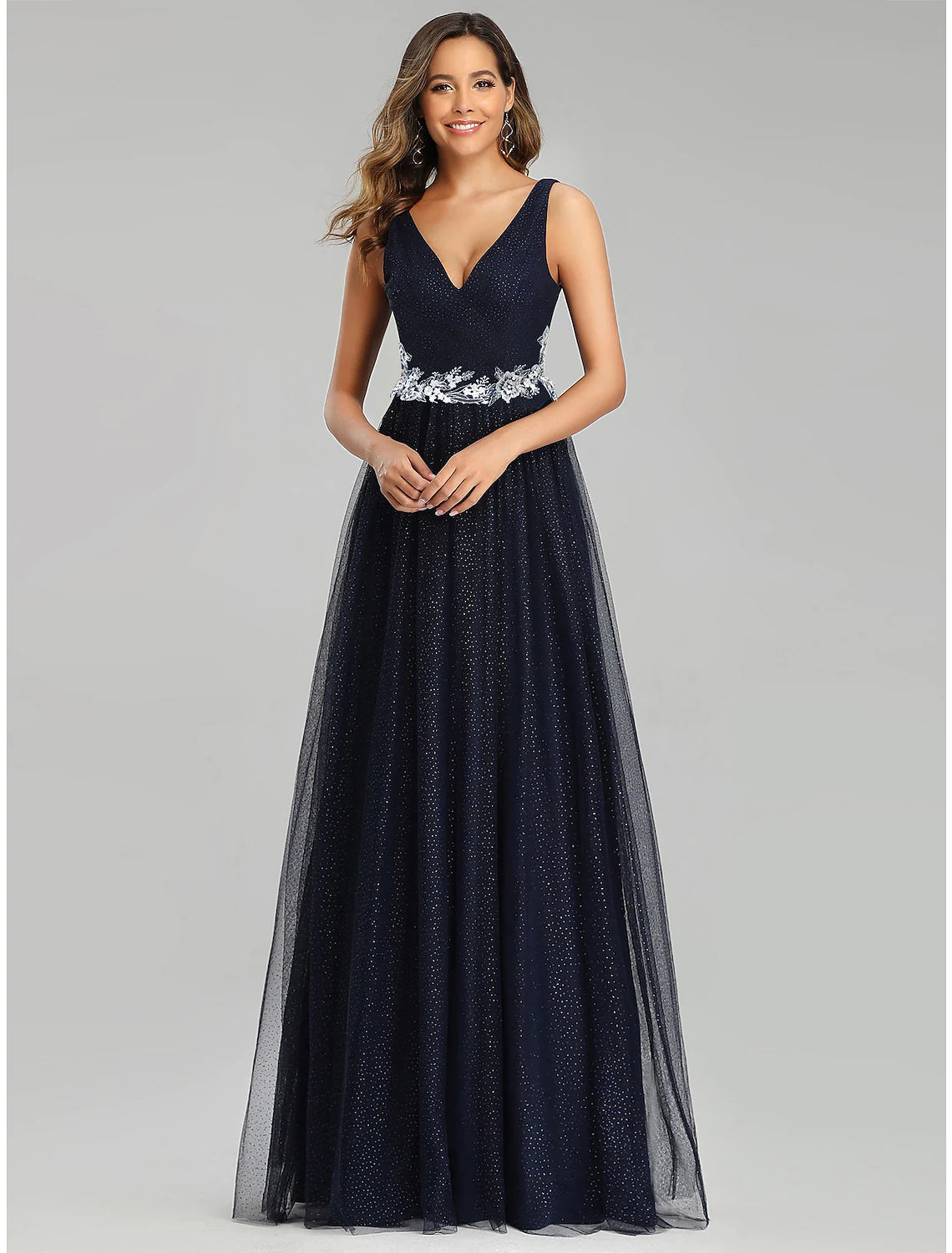 Elegant A-line empire prom dress with V-neck, sleeveless, floor-length tulle, and sequin appliques.