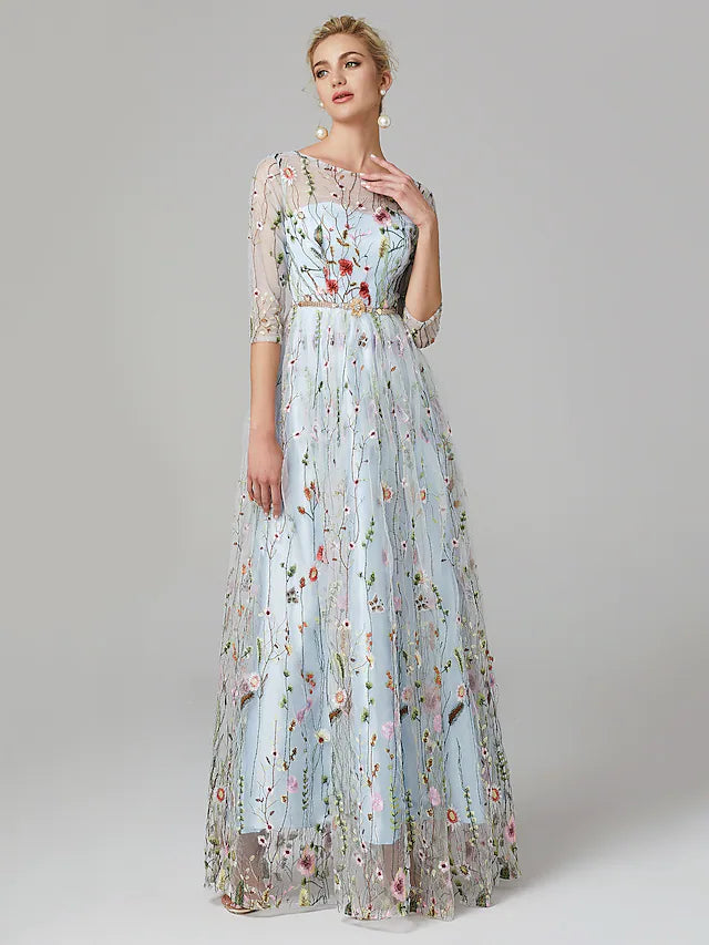 Elegant A-line evening gown with illusion neckline, lace, and 3/4 sleeves.