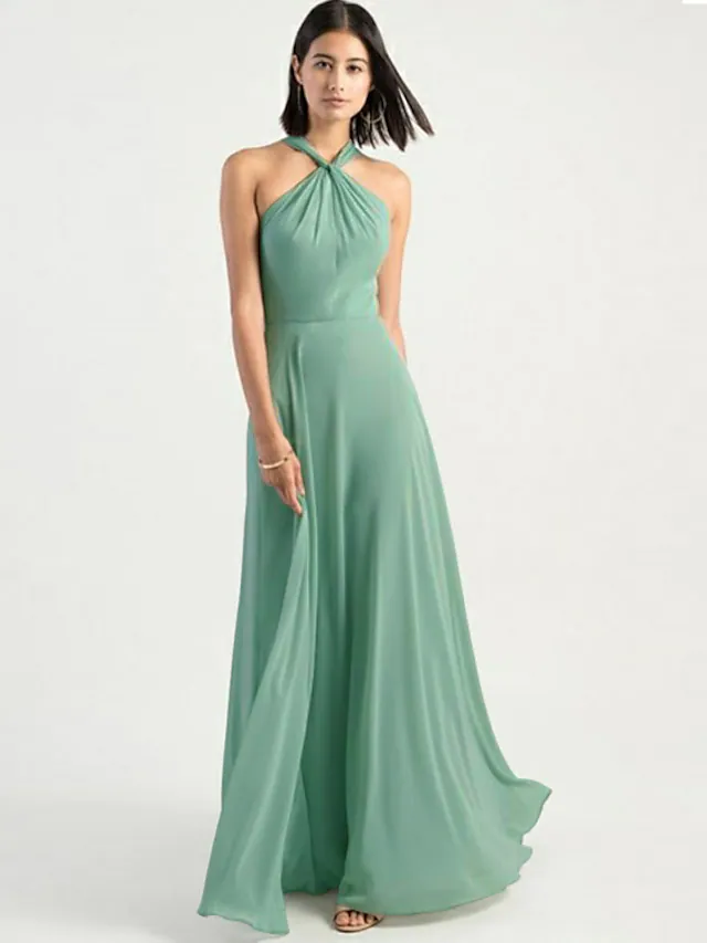 Back view of a floor-length chiffon bridesmaid dress with criss-cross straps.