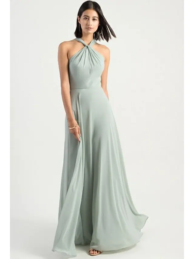 Side profile of a flowing chiffon bridesmaid dress.