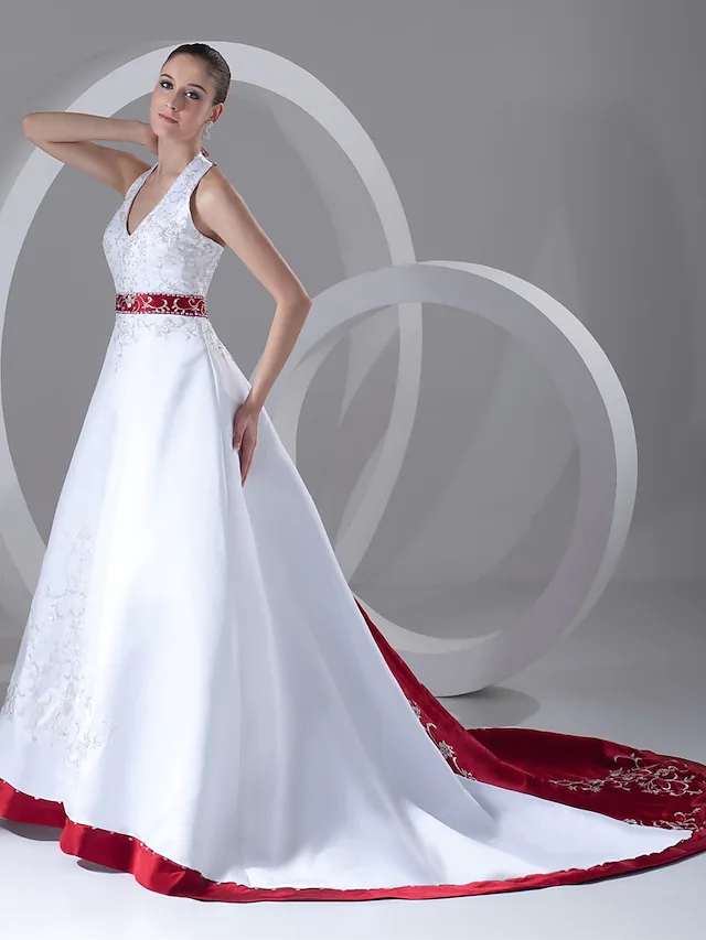 Side profile of the A-Line satin wedding gown with chapel train.