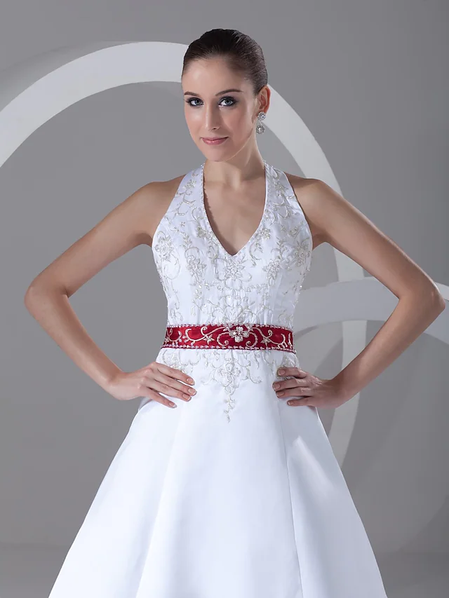 Close-up of the halter neckline with intricate beading and embroidery.