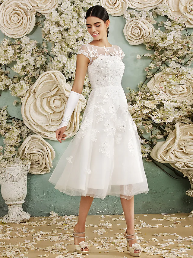 Elegant A-line halter neck wedding dress with sequin details.